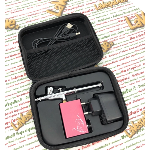 Portable battery-powered airbrush kit with mini compressor, battery charger and USB cable for precise and flawless bodywork touch-ups.