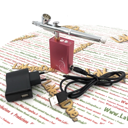 Portable battery-powered airbrush kit with mini compressor, battery charger and USB cable for precise and flawless bodywork touch-ups.