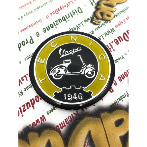 Resin shield Ø 53 mm on aluminum base Vintage aluminum logo emblem VESPA TECNICA 1946 yellow and black to be applied on VESPA accessories with adhesive to be glued Ø 53 mm